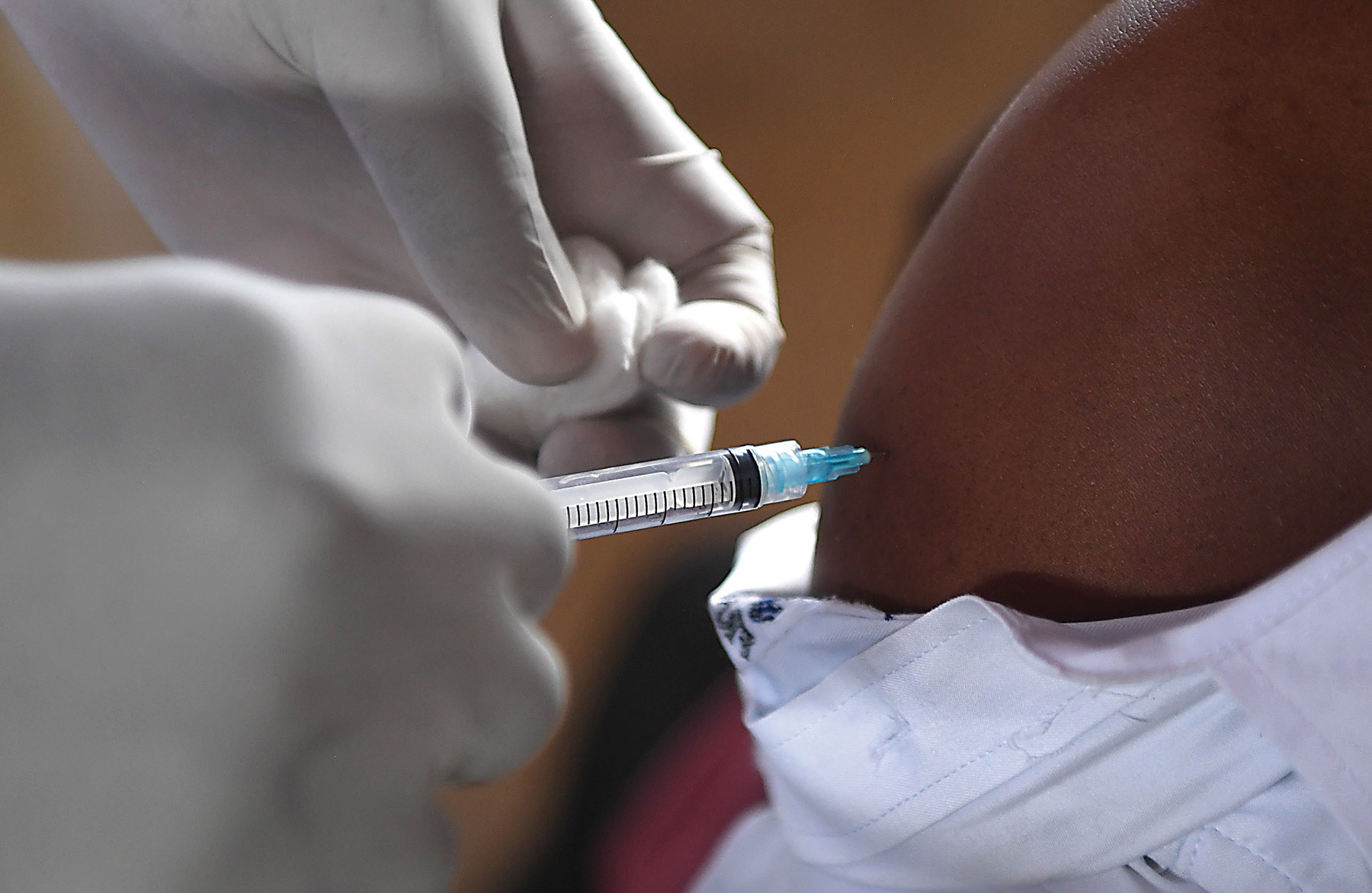 Aperson getting vaccinated
